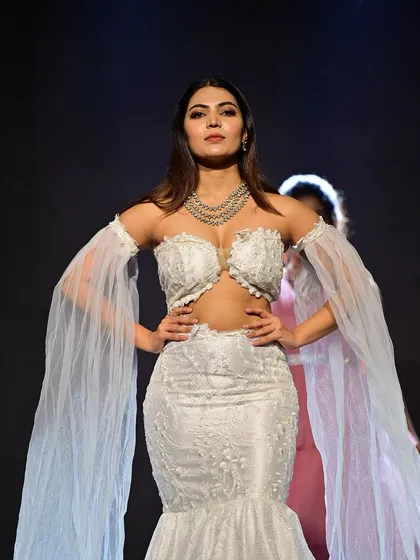 A fierce and powerful runway look in a stunning white lace gown. I created a sharp, defined makeup look with strong contouring and smoky eyes to match the dramatic outfit.