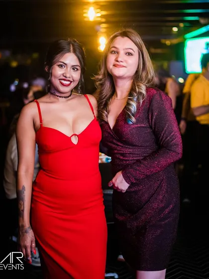 A guest in a stunning red dress.