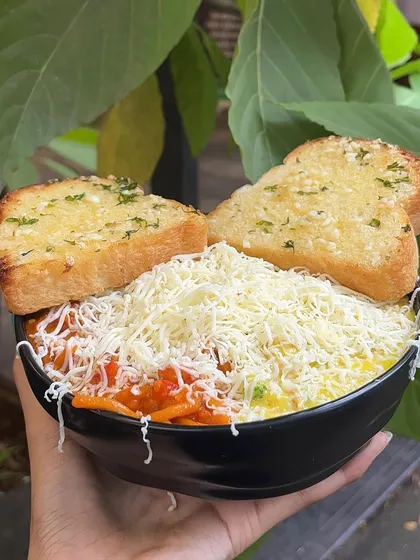 Can't decide between red or white sauce? With my special Pasta & Pasta, you don't have to. I serve both creamy white sauce and tangy red sauce pasta in the same bowl, topped with plenty of cheese and served with garlic bread.