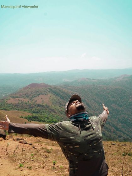 That feeling of freedom with your arms wide open at Mandalpatti viewpoint in Coorg. The panoramic views of the Western Ghats are absolutely breathtaking.