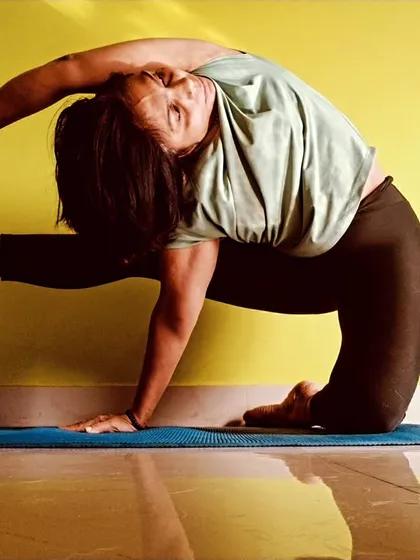 My personal practice is where I find my center. This is a variation of Parivrtta Eka Pada Rajakapotasana, a deep twisting pigeon pose that challenges balance and enhances spinal mobility. It’s a reminder that yoga is a continuous journey of purification for the body and soul.
