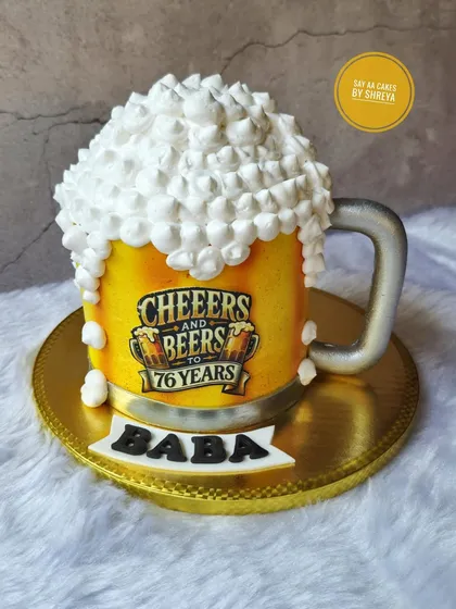 Cheers to 76 years! This 3D beer mug cake is fully sculpted and features an edible print for the label. The overflowing foam on top is made from light, fluffy meringue, making it a fun and realistic cake for any beer lover's birthday.