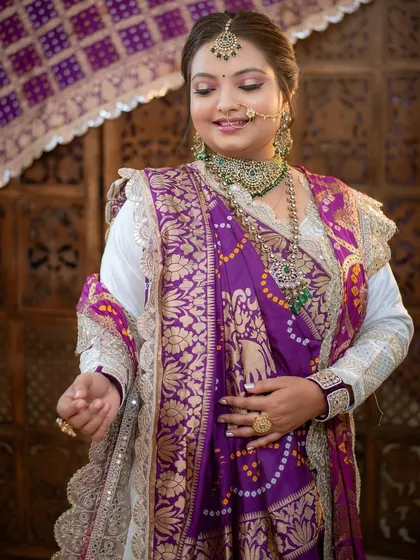 A candid shot that captures the movement and grace of the traditional Gujarati attire.