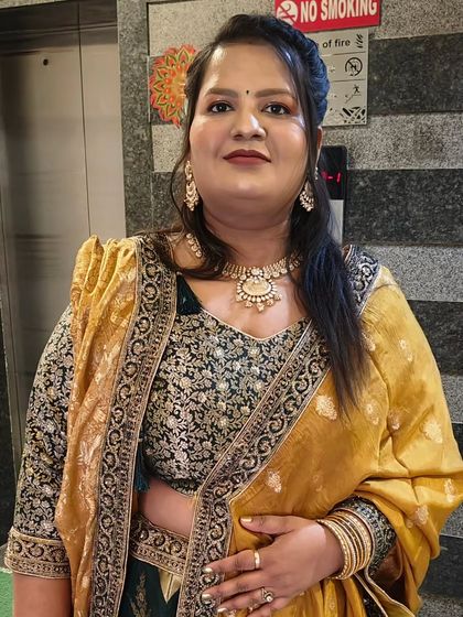 She looks ready for any celebration with this flawless HD makeup. The focus is on radiant skin and defined eyes.