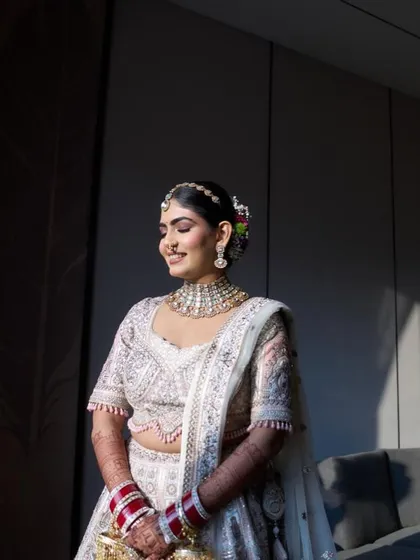 My beautiful bride Disha, ready for her Pheras. She looked like a dream in her white and pink lehenga. The makeup was kept soft and romantic, with pink tones on the eyes and cheeks to create a cohesive, angelic look.