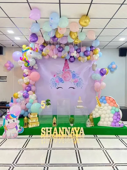 The full view of the pastel Unicorn birthday stage, perfect for a magical 5th birthday party.