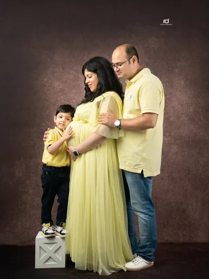 The whole family together, lovingly touching the baby bump. This pose beautifully symbolizes the love and anticipation shared by everyone for the new arrival.