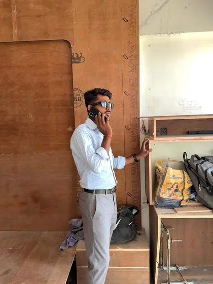 On a call, coordinating supplies and schedules for the project, right from the worksite.