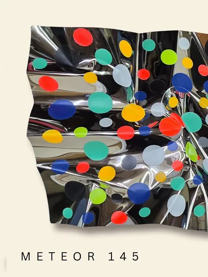 The fluid form of "Meteor 145" catches light from every angle, making the colors pop against the mirrored background.