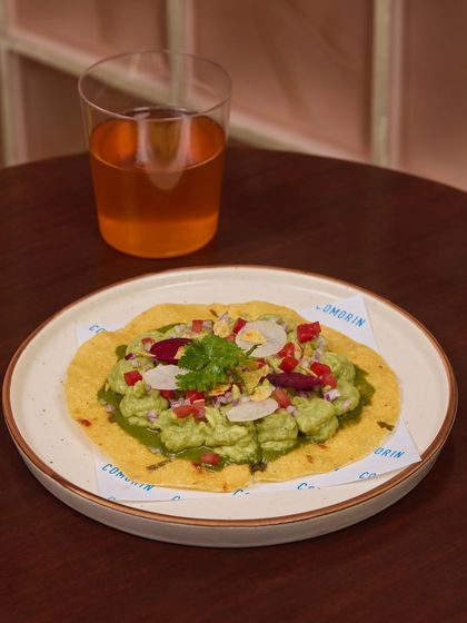 We layered nimbu-masala-spiked avocado on a crisp Banarasi aloo papad and topped it with fresh radish and onions. It's a snack worth talking about.