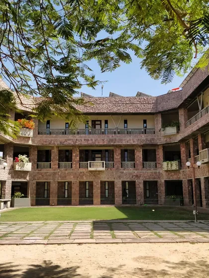 A view of the IIHMR University campus in Jaipur, nestled in greenery. We used local stone and designed the buildings around linked courtyards, creating a space that feels rooted in its environment and encourages interaction and learning.