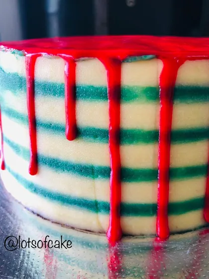 I love playing with colors and techniques. Here is a striped buttercream cake with a bold red drip, a fun and modern design we can explore in my frosting and design class.
