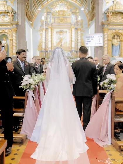 The bride walking down the aisle in a beautiful church. I love capturing the grandeur of a church wedding and the emotion of this significant walk.