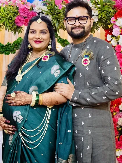 A minimal and beautiful set for the parents-to-be. The mom wears a simple Tagar bud necklace and earrings, while the dad has a matching floral brooch with a peacock feather.