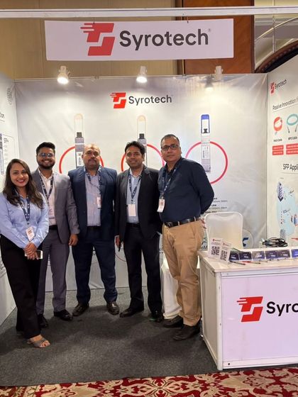 The Syrotech team at our booth during Bharat PSU Manthan 2025, ready to discuss our fiber network and connectivity solutions for the public sector.