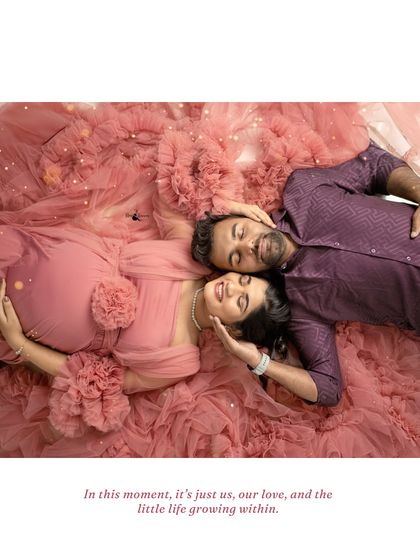 An artistic shot from above, showing the couple lying in a nest of pink fabric. This pose is intimate and creates a stunning visual of their connection.