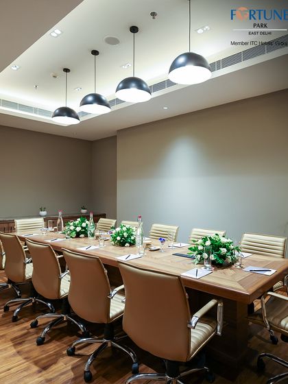 My boardroom is designed to foster collaboration in a refined setting. The combination of natural wood, comfortable seating, and soft lighting creates an environment conducive to impactful business conversations.