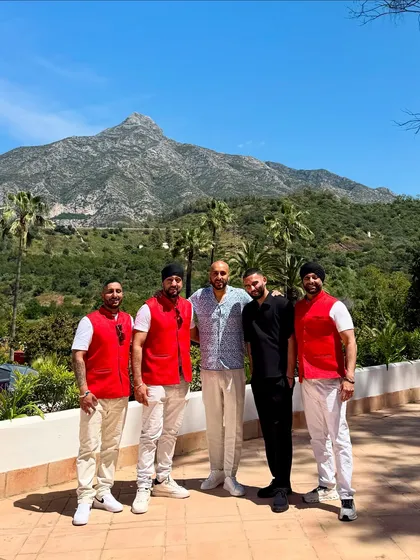 The whole crew posing against the mountain backdrop in Marbella. What a team, what a location.