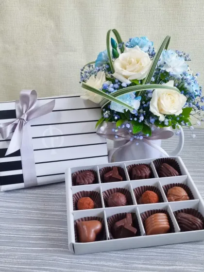 A classic Father's Day gift set featuring my 12-piece handmade chocolate praline box alongside a fresh floral arrangement. It's an elegant and timeless way to show your appreciation.