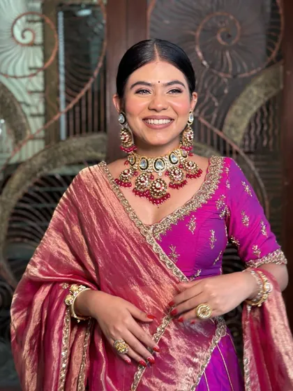 A full, happy smile, looking absolutely stunning.