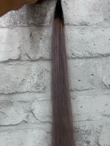The same icy lavender swatch against a different background. Notice how the background can change the perceived warmth or coolness of the hair color.