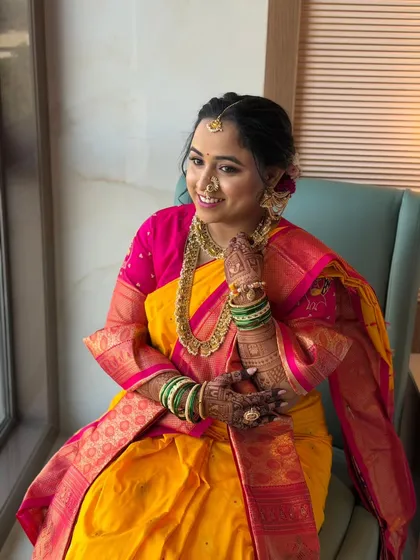 Another stunning portrait of the bride. The lighting from the window creates a beautiful, natural glow, highlighting the subtle details of her makeup.