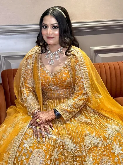 A bright and happy bride-to-be. The makeup is designed to enhance her features and give her a radiant glow.