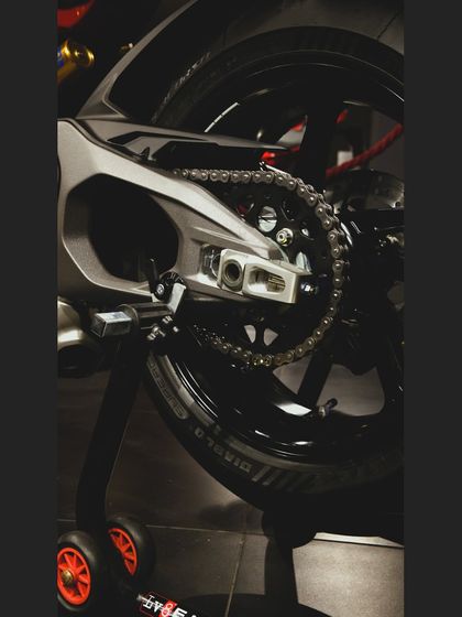 The single-sided swingarm of the Ducati Panigale V4, a signature of Italian design and engineering.