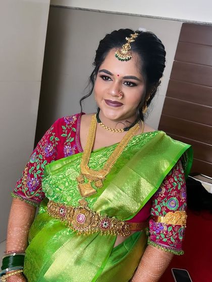 Another angle of Gowthami's baby shower look. The makeup is soft and pretty, letting her natural beauty shine.