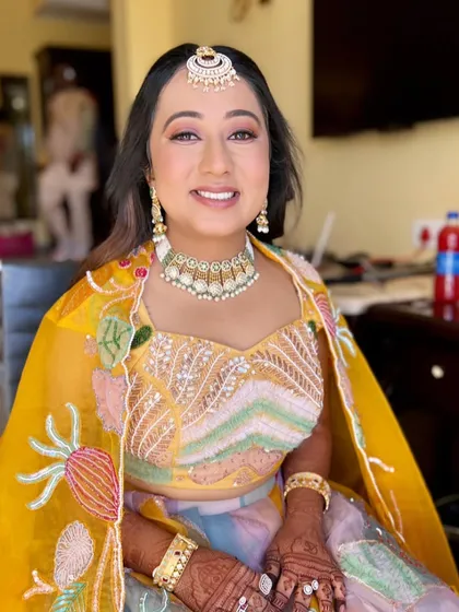 A happy and confident bride-to-be. Varija's makeup is designed to make her feel beautiful and comfortable during her pre-wedding festivities.