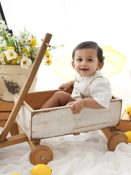 A basket of sunshine. Our lemon garden theme is fresh, bright, and full of happiness. This little boy's smile is as bright as the lemons surrounding him in this cheerful and rustic setup.