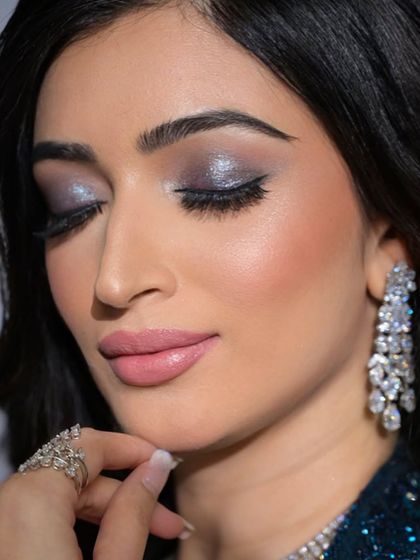 A close-up of the stunning silver and blue shimmer on the eyes. This look is perfect for a bride who wants a touch of drama.