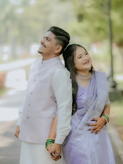 A playful and happy moment between the couple. The bride's mehndi is a beautiful part of her engagement look.