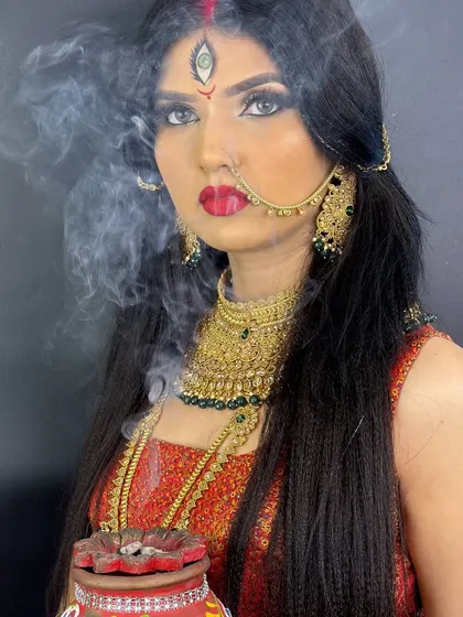 A powerful and divine makeup look inspired by the goddess Durga, created for a festive photoshoot.