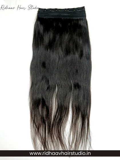 Our 5-clip ear-to-ear straight clip-in extension, shown in its full length. This single piece provides significant volume and is easy to apply for a quick hair transformation.