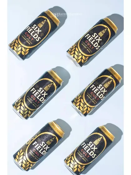 A fun, graphic flat lay using hard light to create strong, repeating shadows with these beer cans. This kind of bold, patterned shot is perfect for making a brand stand out on social media feeds.