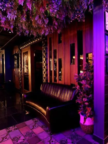 The entrance and lounge area of Harmony Inn, where our automated lighting system sets the mood from the moment guests walk in. The purple and warm tones create a memorable and stylish first impression.