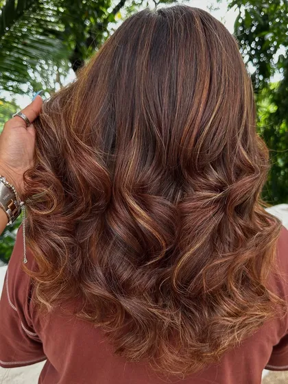 Travel ready. A good hair color and style can make you feel put-together and confident, no matter where you're heading. This warm, multi-tonal look is perfect for any adventure.