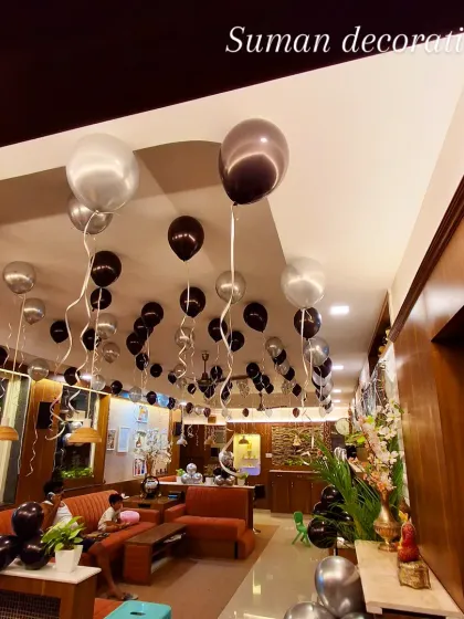 This photo shows how ceiling balloons can completely change the feel of a venue, adding a festive and celebratory touch to the entire space.