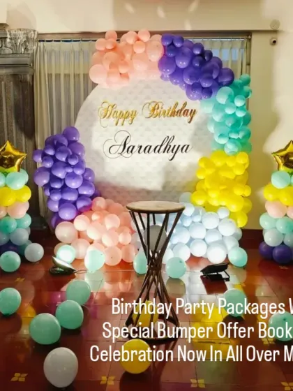 A colorful and cheerful balloon ring decoration for a home party. The mix of pastel colors and star-topped balloon pillars creates a fun and festive atmosphere.