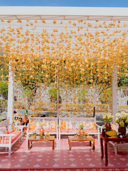 Another angle of the stunning lounge with hanging yellow tassels, creating a curtain of sunshine.
