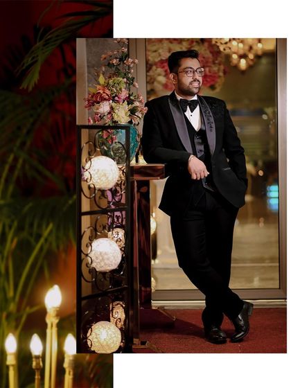 A stylish, full-length portrait of the groom, Shivam, at his engagement party.
