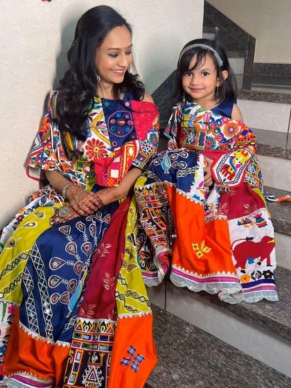 Twinning with your little one is the cutest trend. I created a fresh, subtle makeup look for this lovely mother celebrating a traditional Gujarati ceremony with her daughter, both shining in colorful outfits.