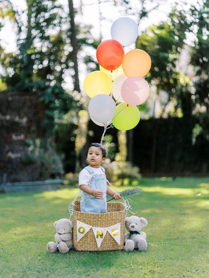 A variation with colorful balloons, creating a bright and cheerful outdoor birthday portrait.