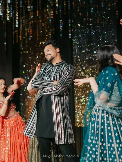 Our lead choreographer enjoying a dance with the bride's squad. We become part of the family and love celebrating with you on the dance floor.