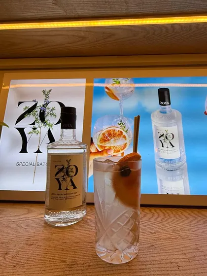 A beautifully crafted Zoya Gin cocktail, served at a brand event. We create drinks that are not only delicious but also perfectly represent the brand's image.