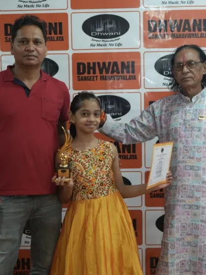 A student, her father, and our senior instructor share a proud moment. We value the connection between generations in the pursuit of art.