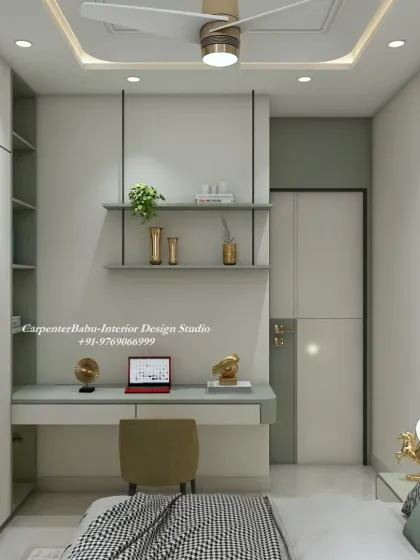 This bedroom features a compact study nook integrated with the wardrobe. The use of sage green and white creates a fresh and modern look, perfect for a smaller room.