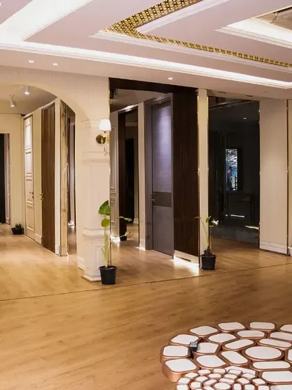 Another view of our Ghitorni experience center, showcasing a wide variety of door designs in a beautiful, expansive setting.