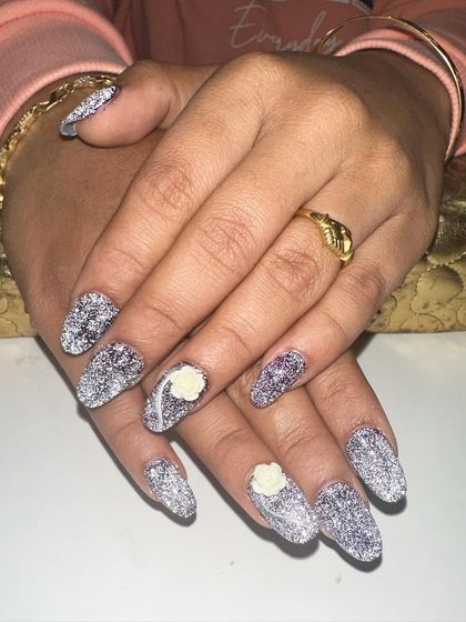 See the difference a camera flash makes. These nails are coated in a special reflective glitter that shines incredibly bright when the light hits it.